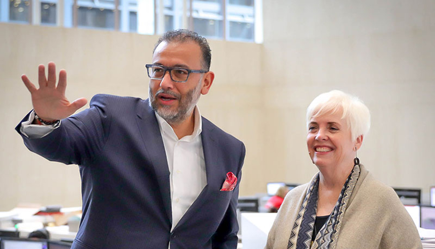 Senior Principal Art Chavez shows Dean of the University of Houston Gerald D. Hines College of Architecture and Design,  Patricia Oliver, around the recently remodeled Page office. - 
