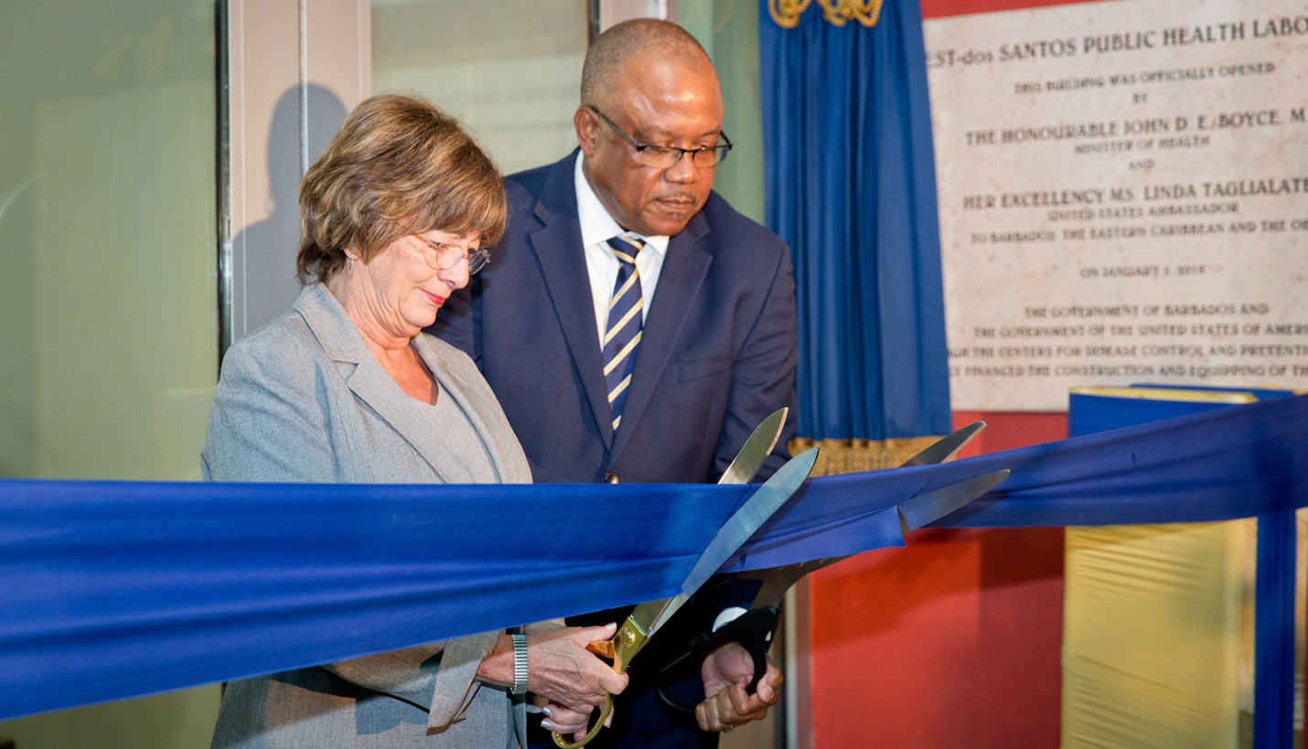 Her Excellency Linda S. Taglialatela, Ambassador of the United States to Barbados, the Eastern Caribbean, and the OECS and the Honorable John Boyce, Barbados Minister of Health, cut the ribbon to officially announce the opening of the new National Medical Reference Laboratory. - Jacob Krupnick, Wild Combination Photography