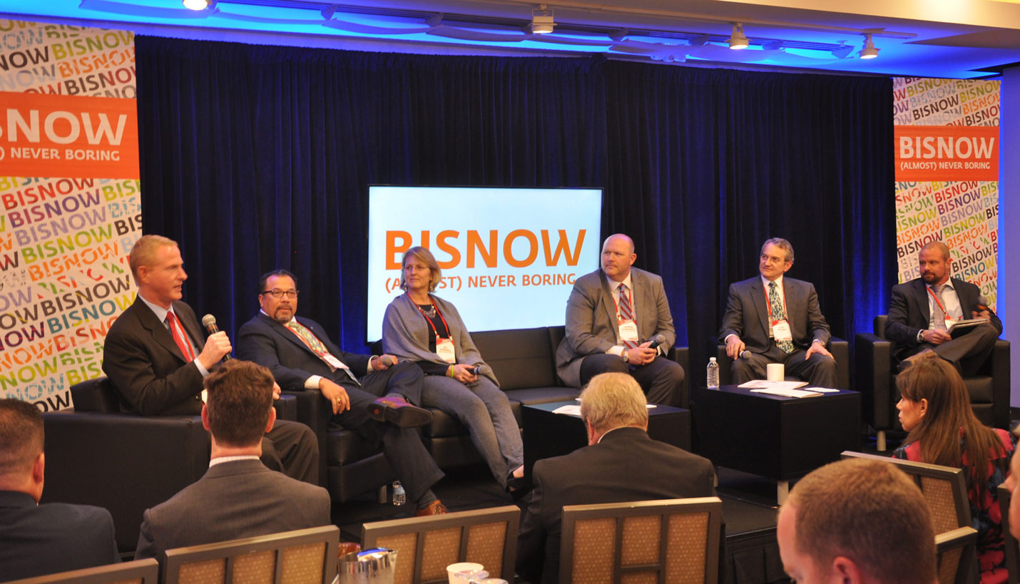 (L-R) Members of a recent Bisnow National Healthcare Conference panel included Whit Robinson, MD Anderson Cancer Center (speaking); Lance Mendiola, CHRISTUS Health; Jill Pearsall, Texas Children’s Hospital; Andrew Burkhardt, Catholic Health Initiatives (CHI); Kurt Neubek, Page Healthcare Practice Leader and moderator David Winfrey. - Kyle Hagerty, Bisnow Media