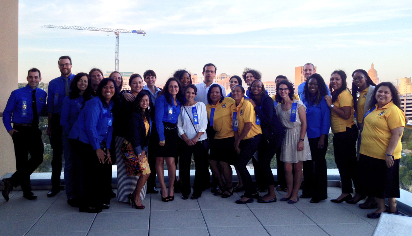 Blackshear staff poses with their Blue Ribbon Distinction on the IBC Bank 13th floor balcony - Diana Su