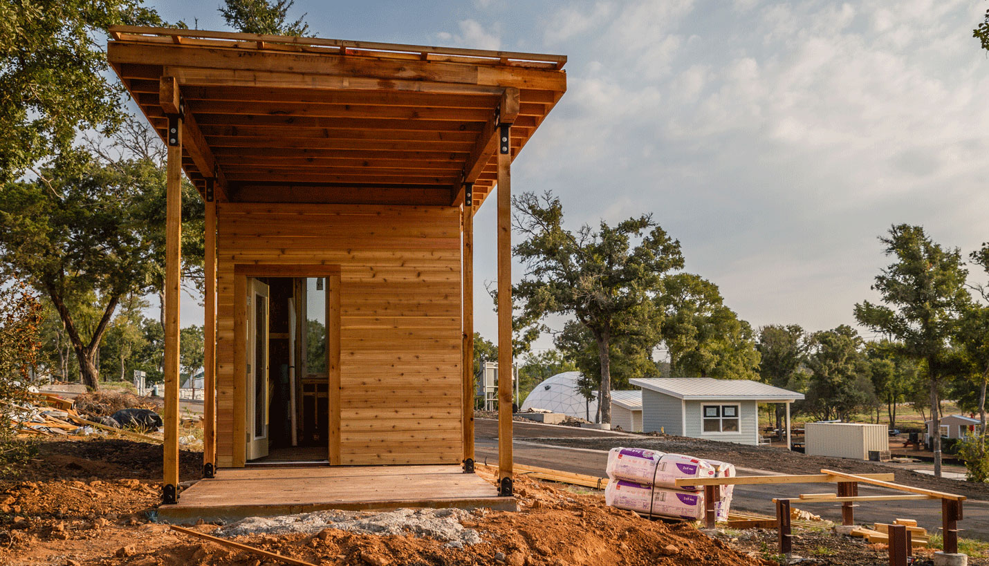 Builders have the opportunity to choose the material on the porch wall of each home, creating variation between the many "Porch" homes at Community First! Village. JGB Custom Homes used tongue and groove siding on this porch wall. - Jessica Mims, See In See Out Photography