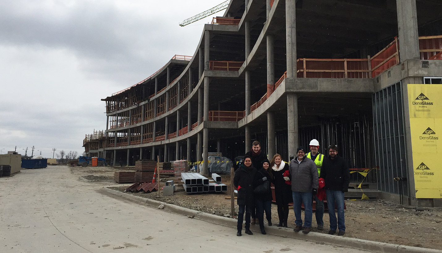 Project team members including several Pagers braved a winter storm to celebrate the topping out of the Children's Health Plano Specialty Center II. - 