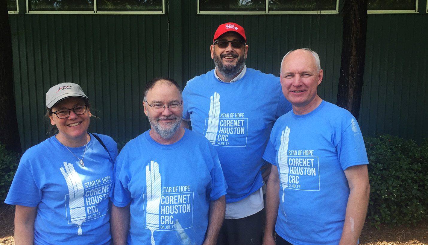 (L-R) Pagers Karen Marnach, Jonathan Vaughan, Andy Brochtrup and Steve Edwards pause during their work on a homeless men's development center. - 