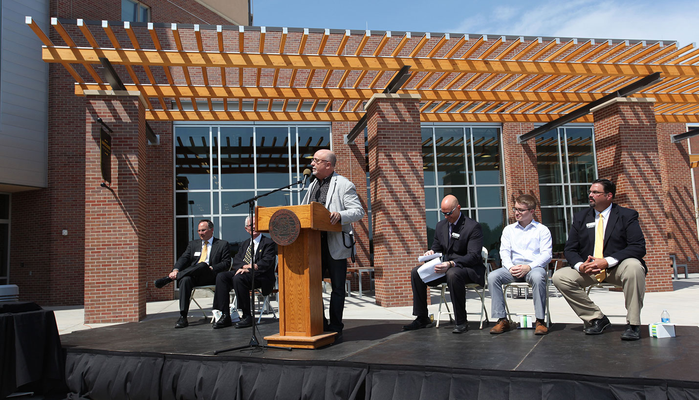 Page Principal Christopher Carvell addressing the audience at the grand opening of Shocker Hall - Page