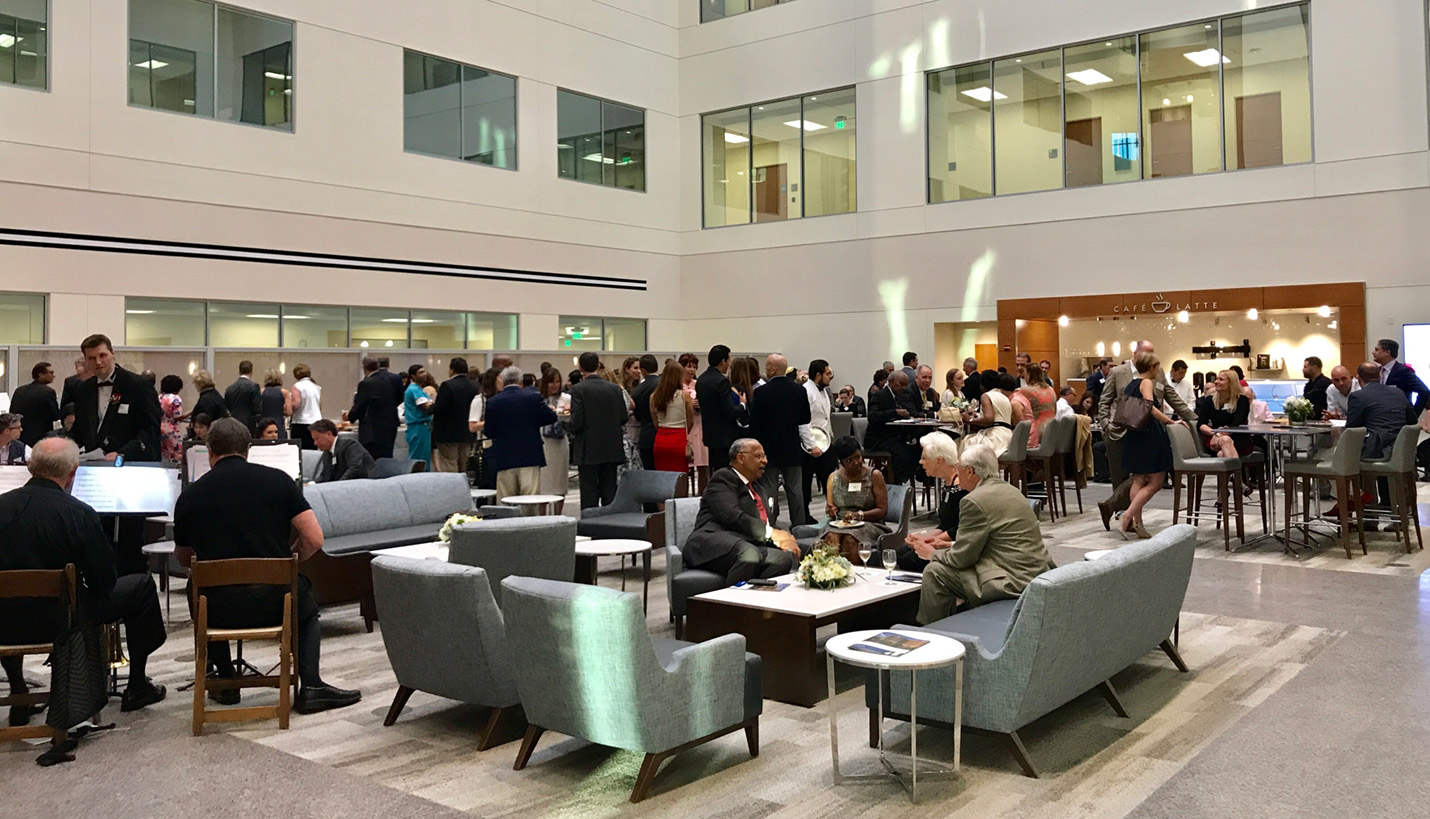 Grand opening attendees gathered in the lobby of the new Houston Methodist The Woodlands hospital to hear remarks from the CEO. - Page