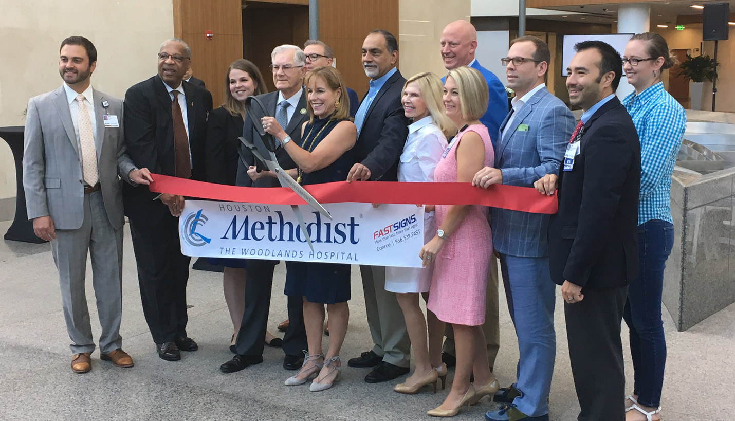 VIPs and members of the Houston Methodist Hospital The Woodlands project team cut the ceremonial grand opening ribbon. - Page
