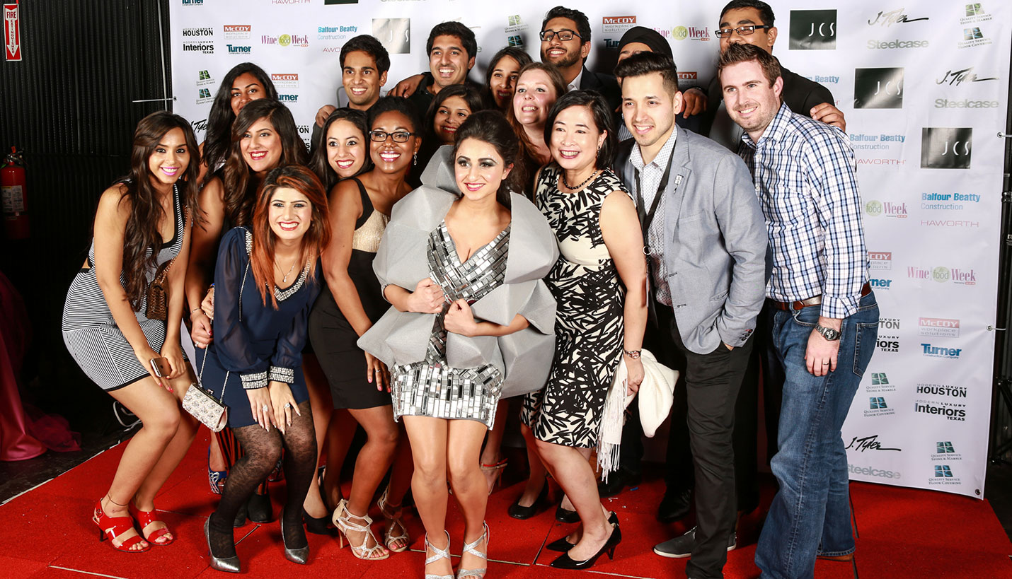Sana Sabharwal, center, and members of the Page Product Runway 2015 pose with colleagues, family and friends. - Andy Phan