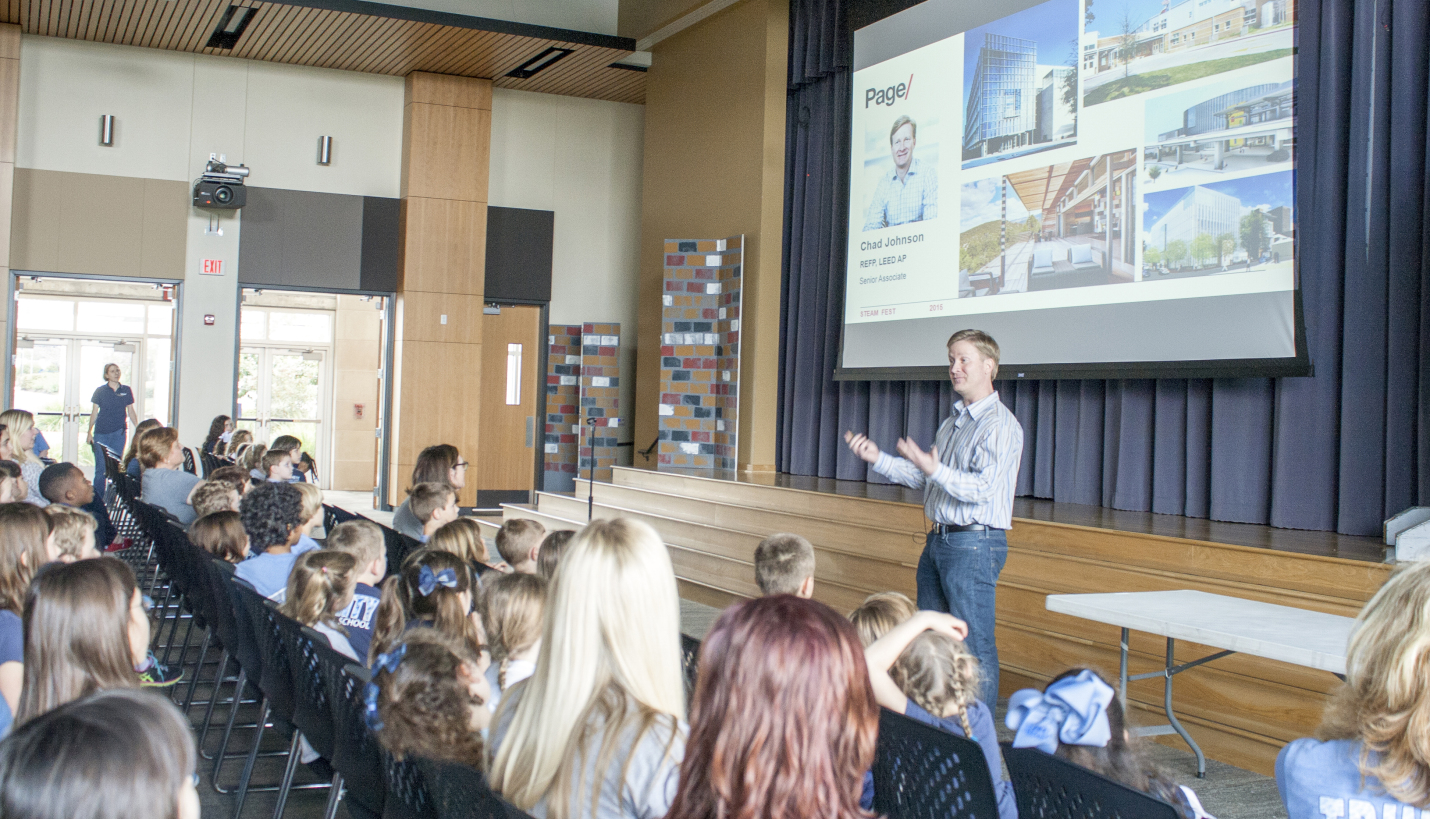 Project designer of Trinity Episcopal School, Chad Johnson, shares his personal story and his passion for architecture with the students during the annual STEAMFest Day. - Page