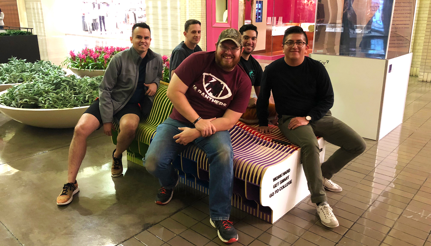 (Clockwise L-R) Happy Pagers Carlos Sierra in gray jacket, Kyle Kiser, Eric Enriquez, Marco Martinez and JT Hevrin after successful installation at the AIA Dallas RETROSPECT 2018 exhibit. - Page