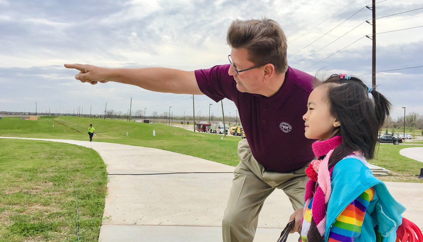The mayor of Sugar Land explains to Pager and PARCS Board Member Andy Phan’s young daughter the family-friendly goals for the park and its role in the anticipated growth for the area. - Andy Phan, Page Director of Visualization