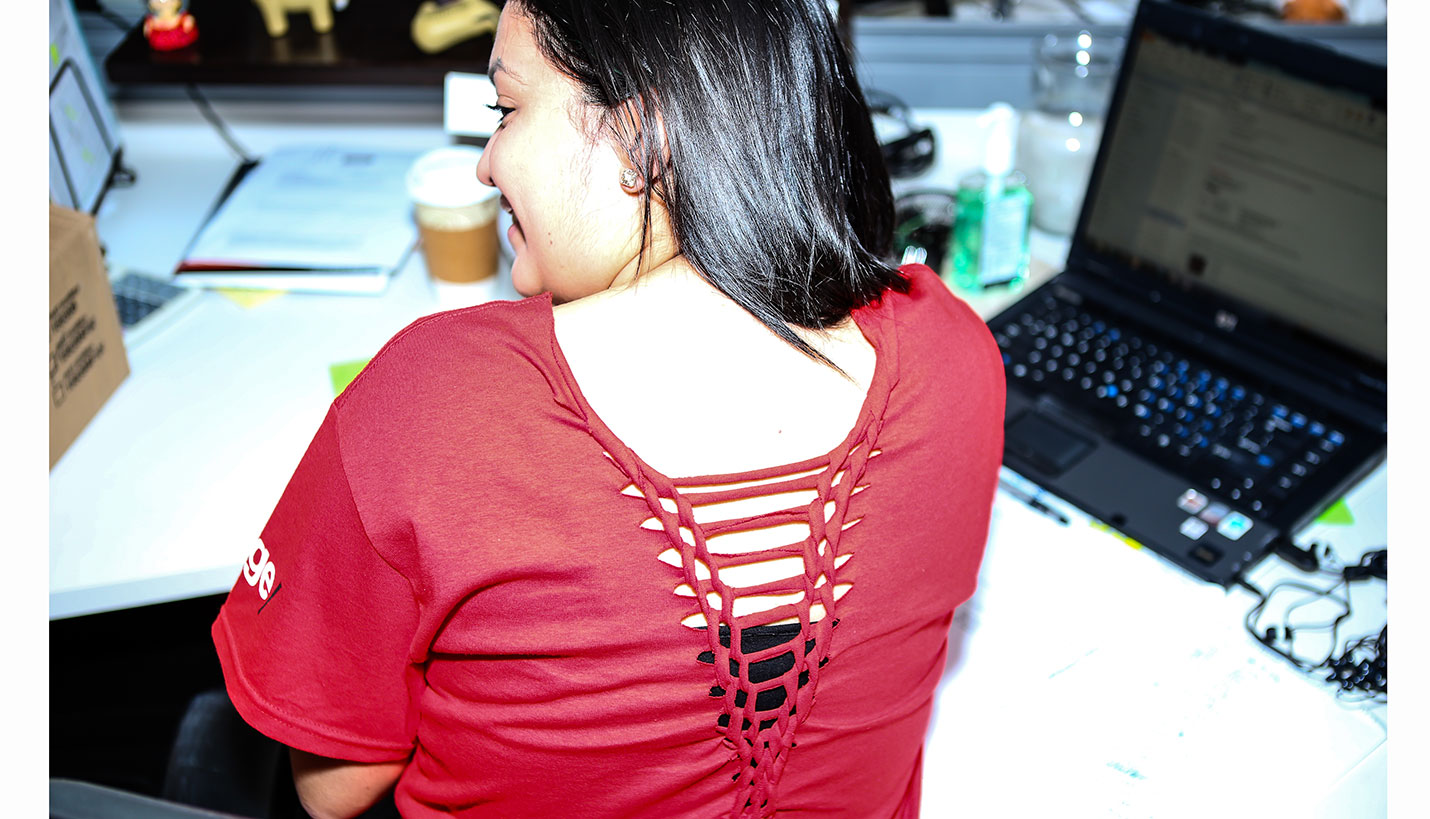 Yasley Carrizales shows her creative braiding technique on the back of her Villalobos-designed Page T-shirt. - Andy Phan, Page Director of Visualization