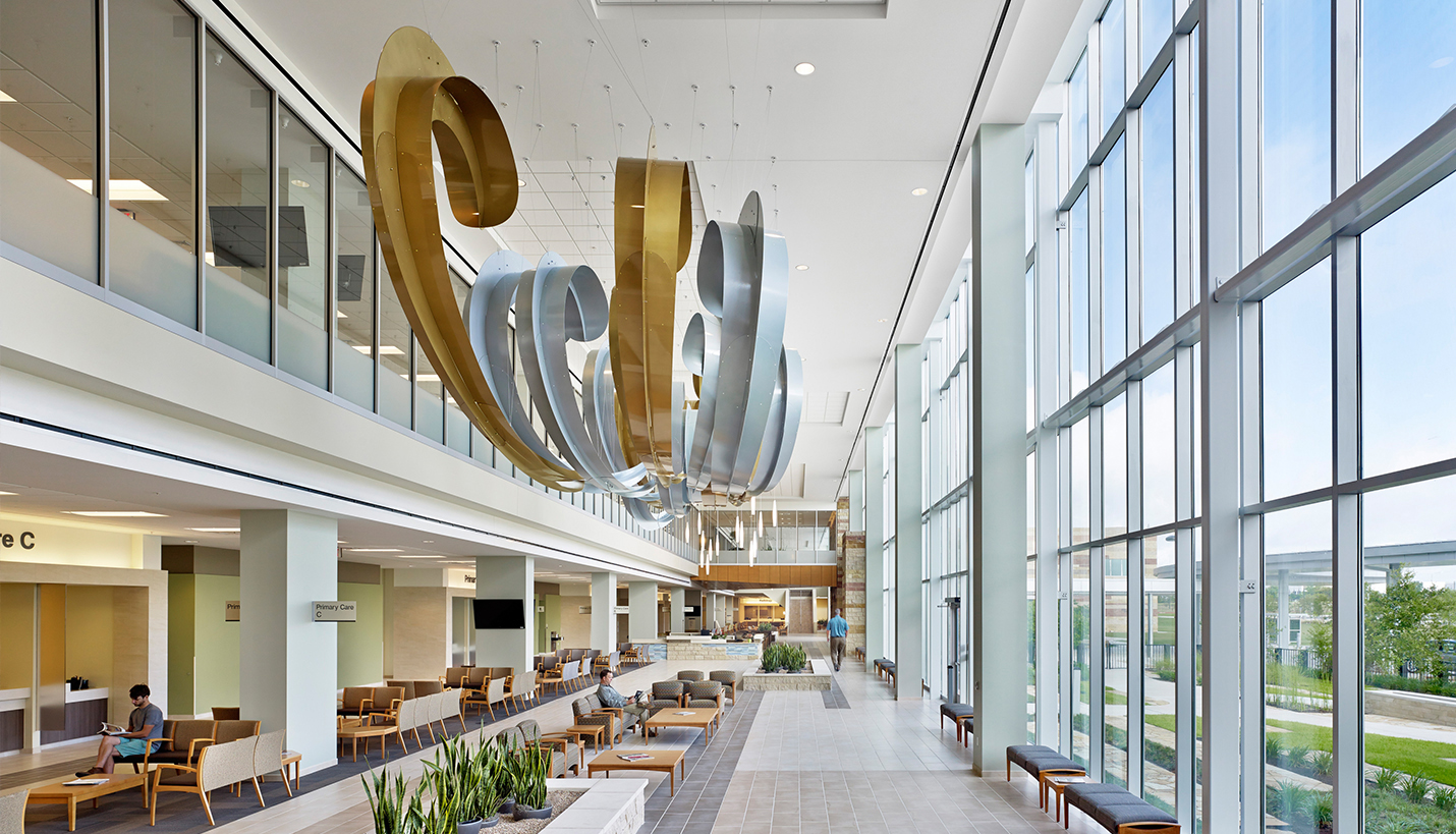 The design of the Austin VA Outpatient Clinic maximizes energy efficiency while creating light-filled public spaces and corridors illuminated by floor-to-ceiling windows that offer occupants visual connections to the outdoors. - © Casey Dunn Photography